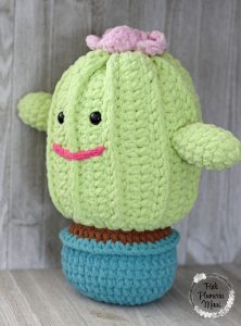A side view of Primrose a crocheted plushy cactus.
